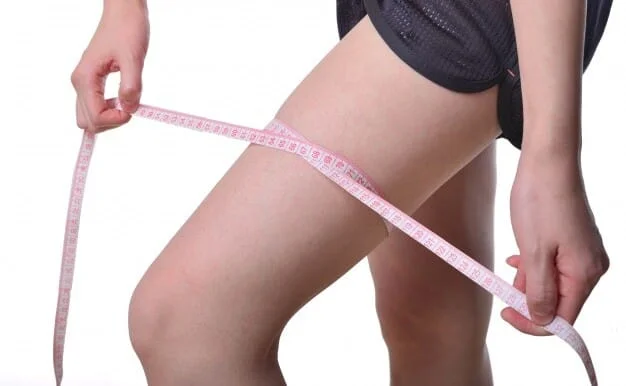 woman-measuring-her-leg_1112-581
