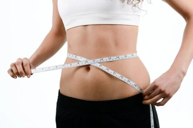 woman-measuring-her-waist_1139-130
